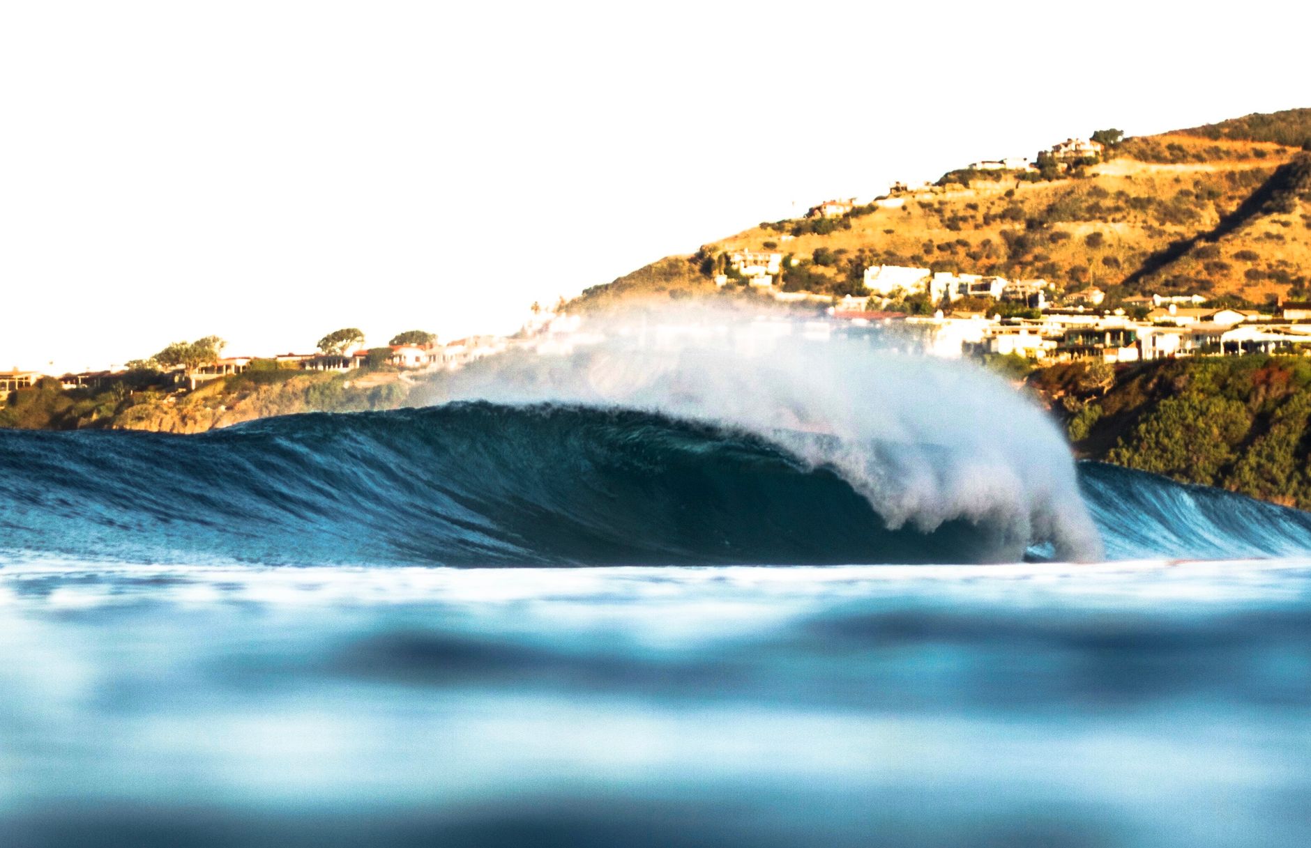 Local SEO in Dana Point, CA near Monarch Beach | OCWebPros. Crashing wave at Dana Point, showcasing surf and ocean beauty und