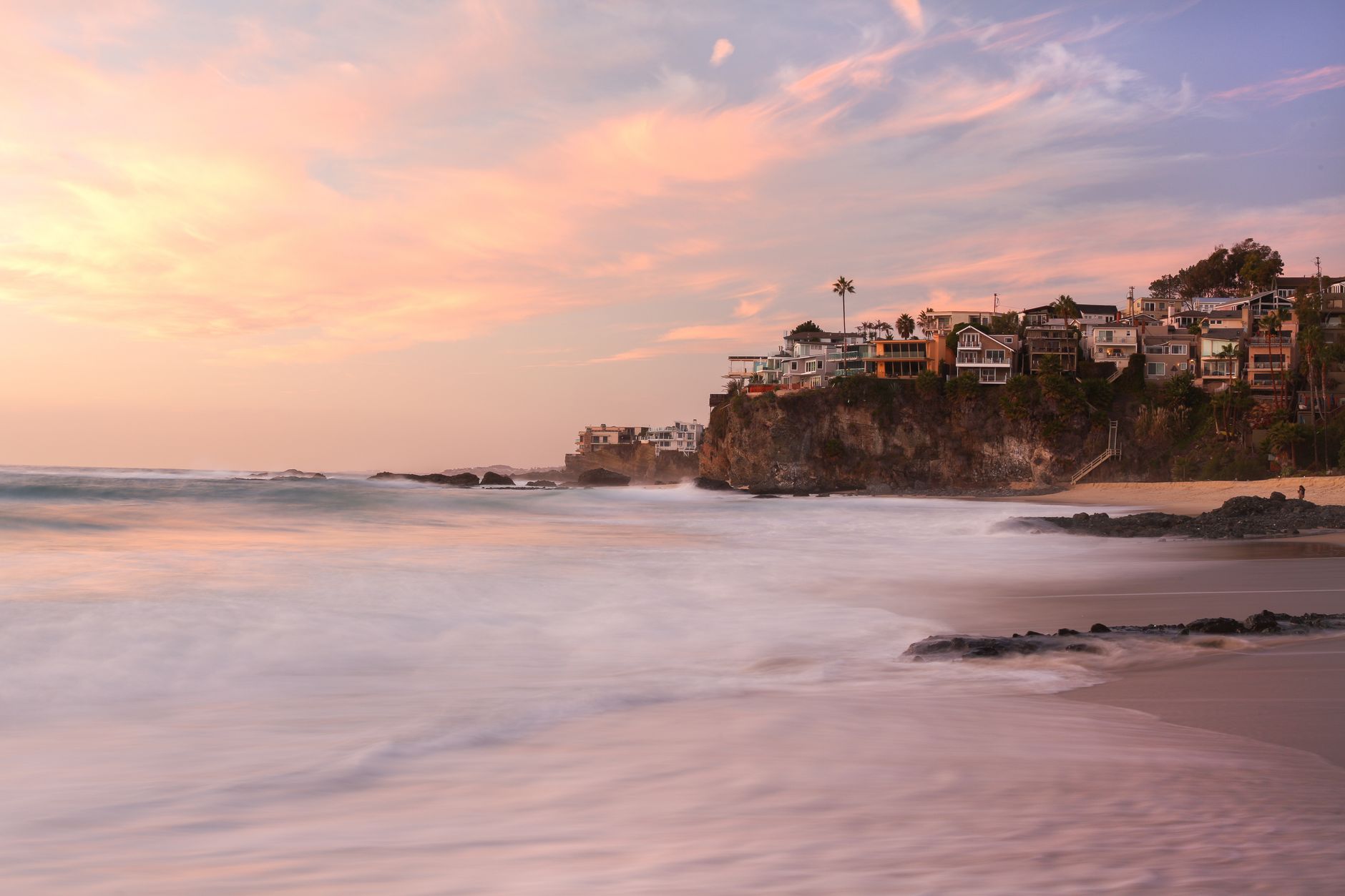Local SEO in Laguna Beach, CA near Heisler Park & Main Beach | OCWebPros. Stunning view of Laguna Beach cliffs against a vibr