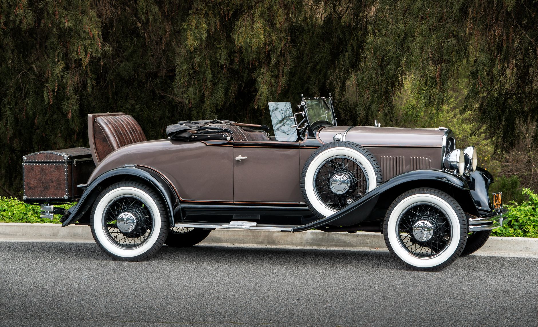 Local SEO in Laguna Niguel, CA near Crown Valley Parkway | OCWebPros. Classic brown convertible parked outdoors with vintage 
