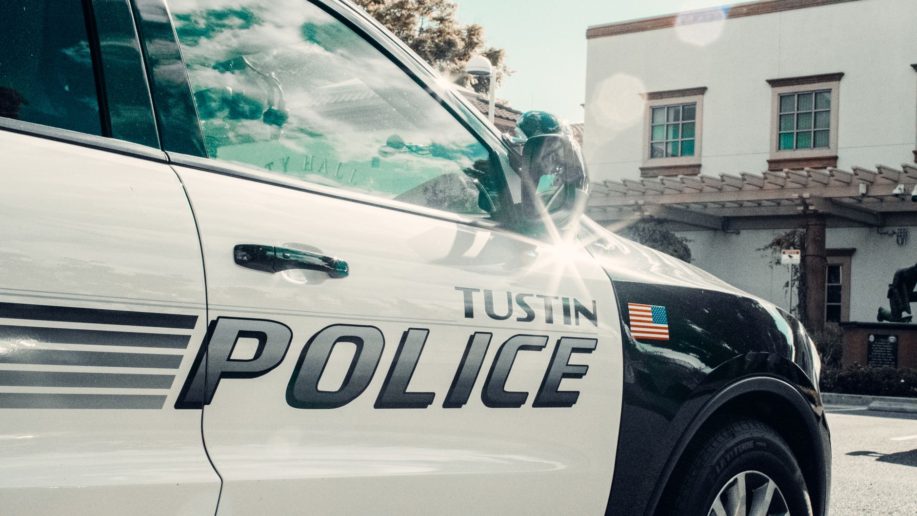 Local SEO in Tustin, CA near Old Town Tustin & Main Street | OCWebPros. Close-up of a Tustin police car parked near a city ha