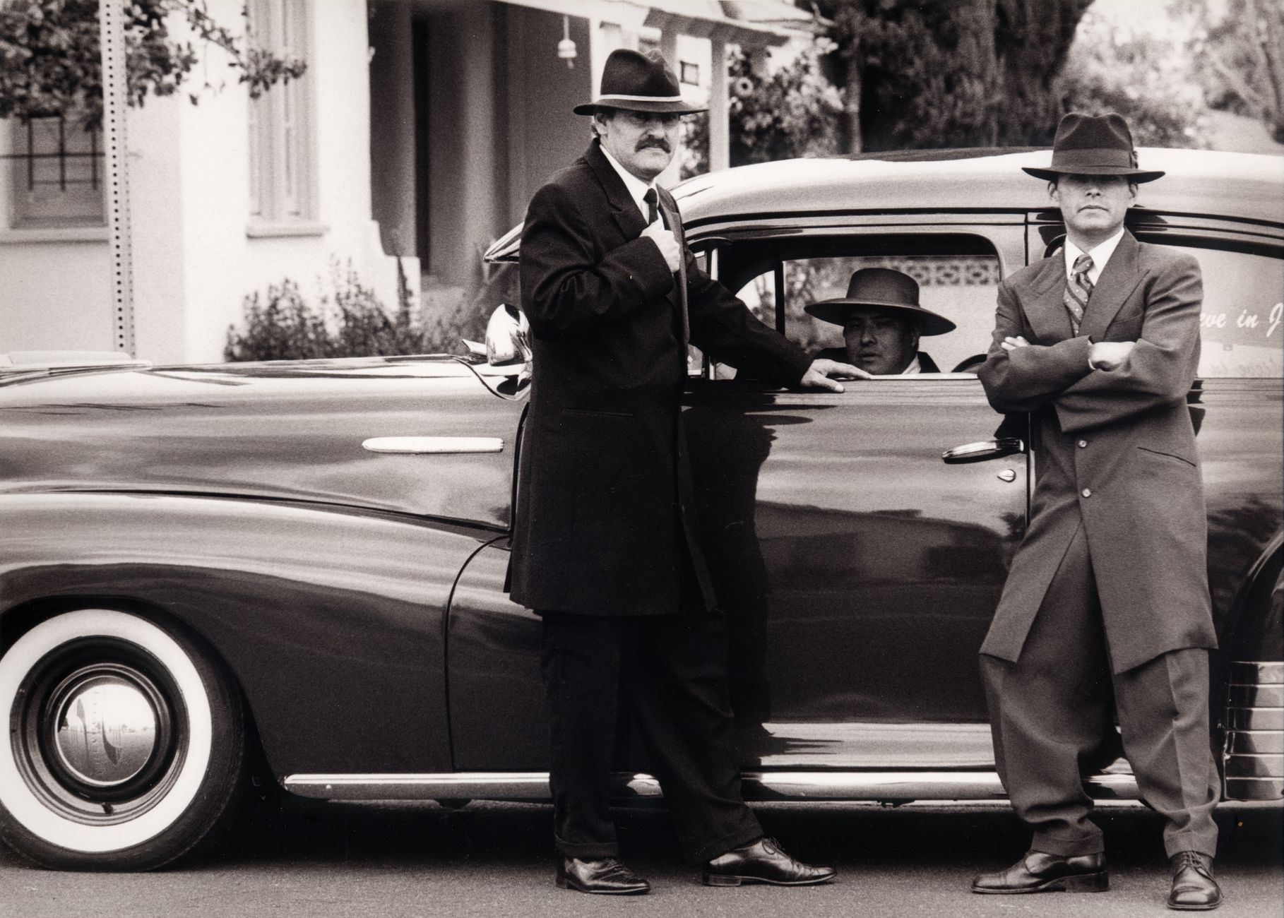 Local SEO in Tustin, CA near Jamboree Road corridor | OCWebPros. Three men in vintage gangster attire with classic car, Tusti